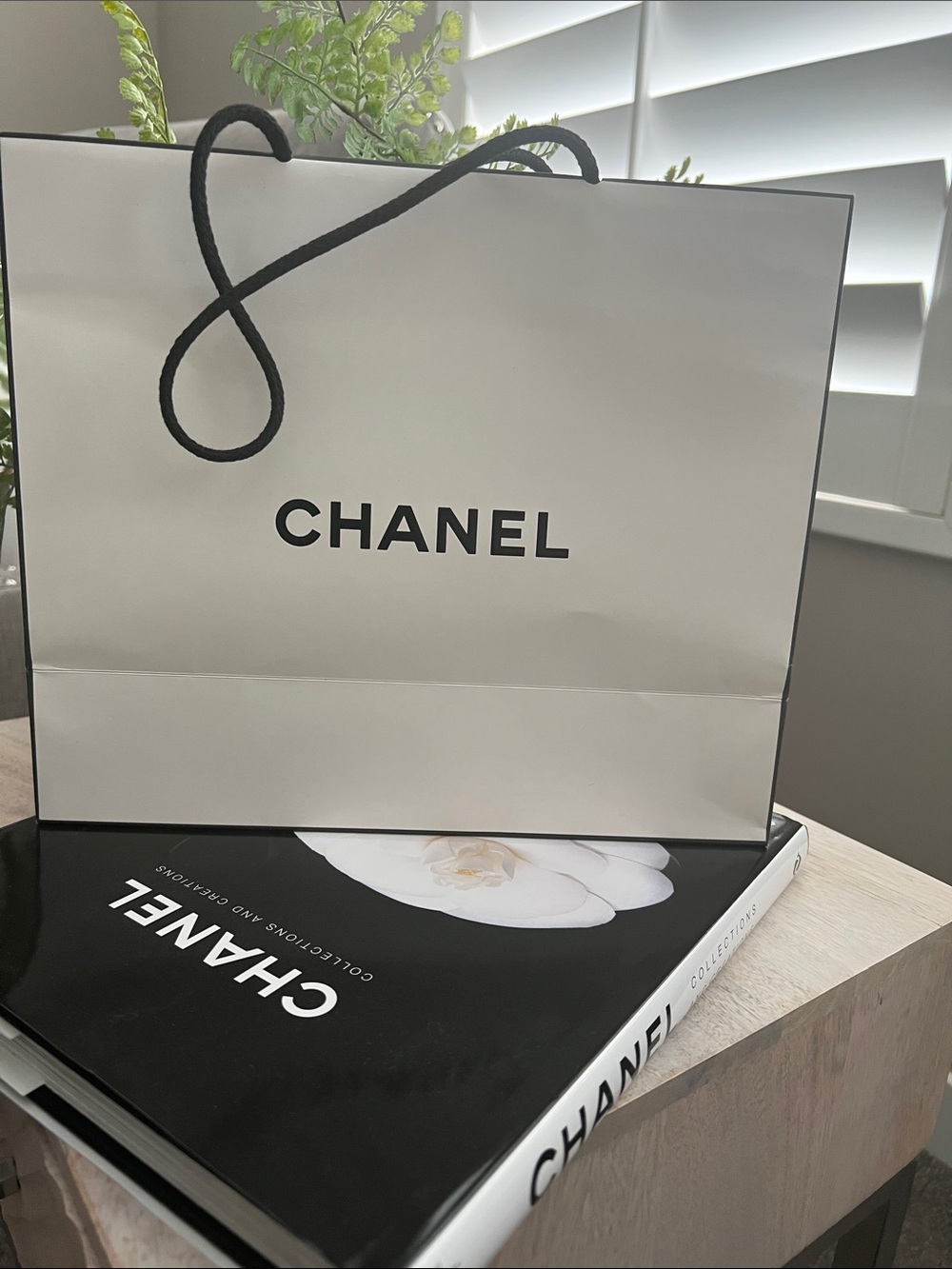 CHANEL Black Cover Coffee Table Book with White Camellia + Chanel papergift bag